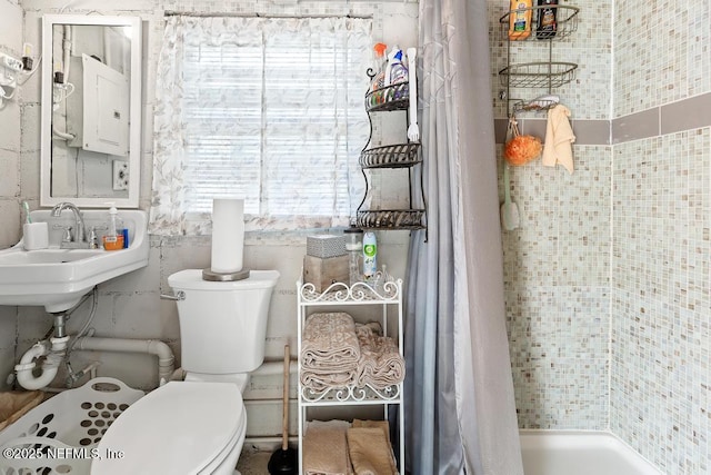 1810 Griflet Rd, Jacksonville, FL 32211 - full bath featuring toilet, healthy amount of natural light, a shower with curtain, and electric panel