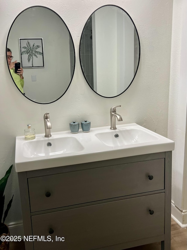 5256 Alpha Ave, Jacksonville, FL 32205 - bathroom with double vanity and wood finished floors