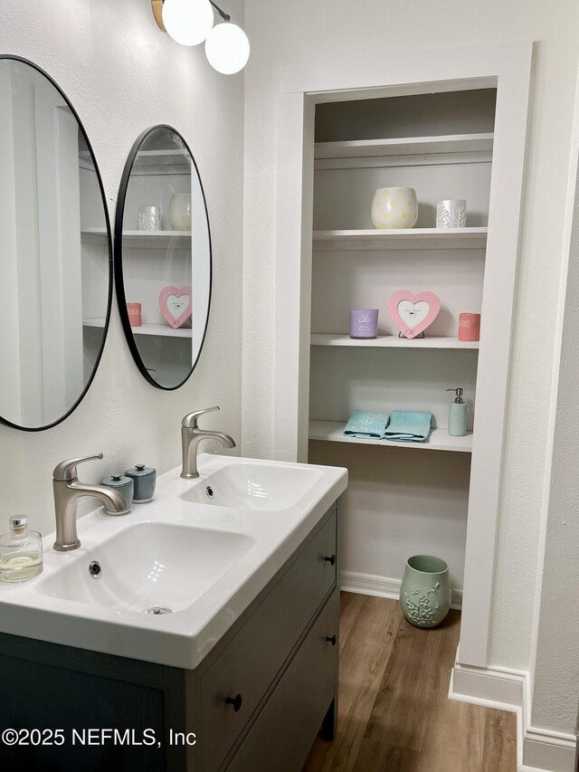 5256 Alpha Ave, Jacksonville, FL 32205 - bathroom featuring wood finished floors and double vanity