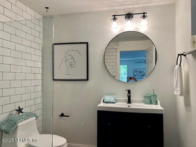 5256 Alpha Ave, Jacksonville, FL 32205 - bathroom with vanity, toilet, and baseboards