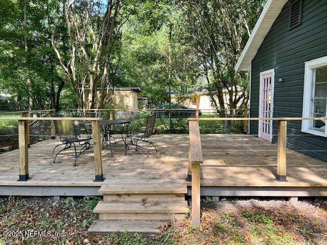 5256 Alpha Ave, Jacksonville, FL 32205 - wooden deck with outdoor dining space