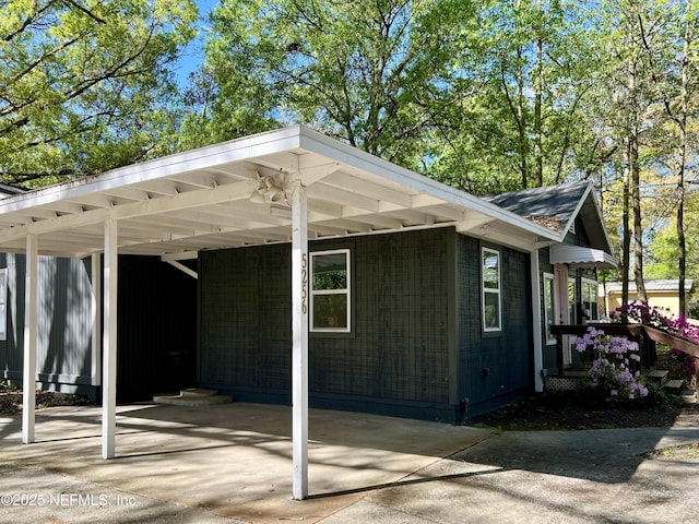 5256 Alpha Ave, Jacksonville, FL 32205 - view of side of property featuring a carport and driveway