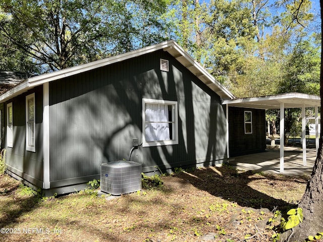 5256 Alpha Ave, Jacksonville, FL 32205 - view of side of home with central AC unit and a patio area