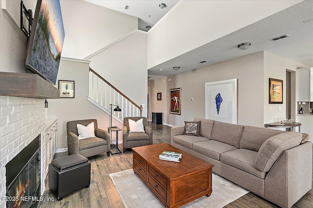436 Marsh Cove Dr, Ponte Vedra Beach, FL 32082 - living area with light wood-style floors, stairs, and a fireplace