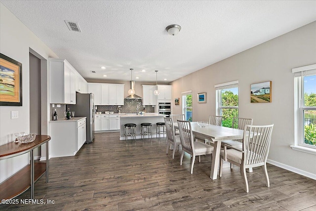 436 Marsh Cove Dr, Ponte Vedra Beach, FL 32082 - dining area with dark wood-style flooring, plenty of natural light, a textured ceiling, and recessed lighting