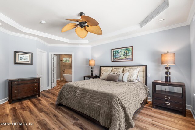 143 Istoria Dr, Saint Augustine, FL 32095 - bedroom featuring a raised ceiling, wood finished floors, baseboards, recessed lighting, and crown molding