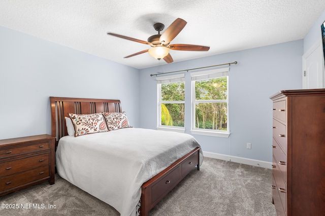 143 Istoria Dr, Saint Augustine, FL 32095 - carpeted bedroom with a textured ceiling, baseboards, and a ceiling fan
