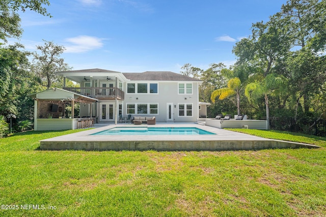 143 Istoria Dr, Saint Augustine, FL 32095 - back of property with french doors, an outdoor living space, ceiling fan, a yard, and an outdoor pool