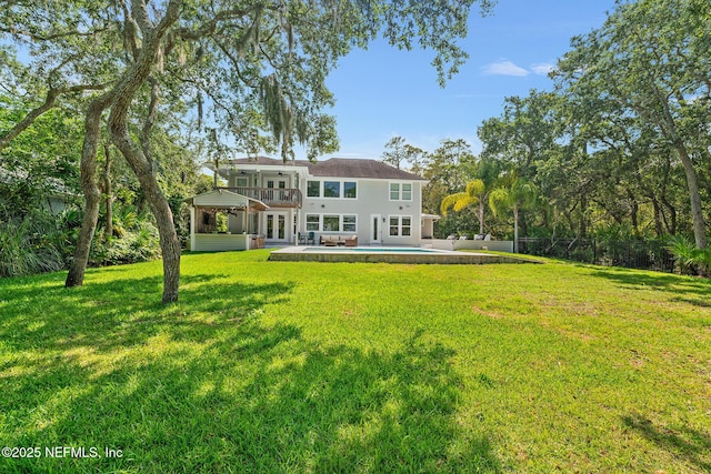 143 Istoria Dr, Saint Augustine, FL 32095 - rear view of property featuring french doors, an outdoor pool, a lawn, ceiling fan, and a patio
