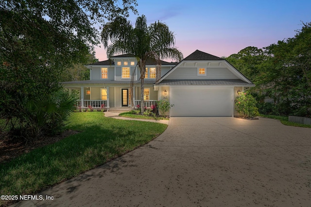 143 Istoria Dr, Saint Augustine, FL 32095 - view of front of house featuring a porch, driveway, a garage, and a yard