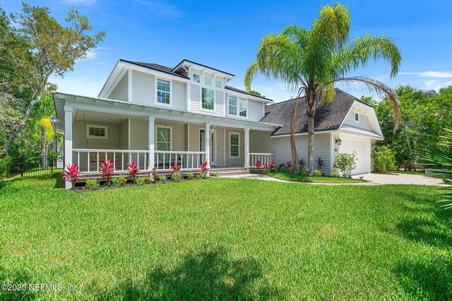 143 Istoria Dr, Saint Augustine, FL 32095 - view of front facade featuring a porch, driveway, an attached garage, and roof with shingles
