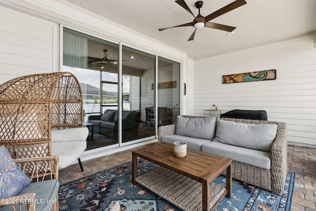 94001 Goodwood Dr, Fernandina Beach, FL 32034 - living area featuring a ceiling fan, wood walls, and brick patterned flooring
