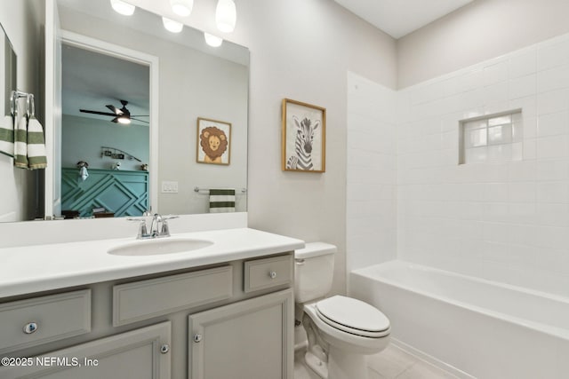 94001 Goodwood Dr, Fernandina Beach, FL 32034 - bathroom featuring vanity, toilet, a ceiling fan, tile patterned floors, and shower / tub combination