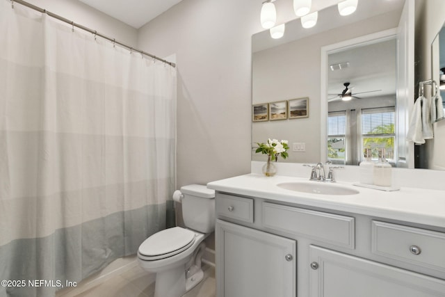 94001 Goodwood Dr, Fernandina Beach, FL 32034 - full bathroom featuring a ceiling fan, toilet, vanity, and a shower with curtain