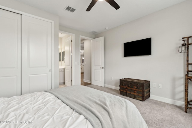 94001 Goodwood Dr, Fernandina Beach, FL 32034 - bedroom with baseboards, carpet floors, ceiling fan, a closet, and ensuite bath