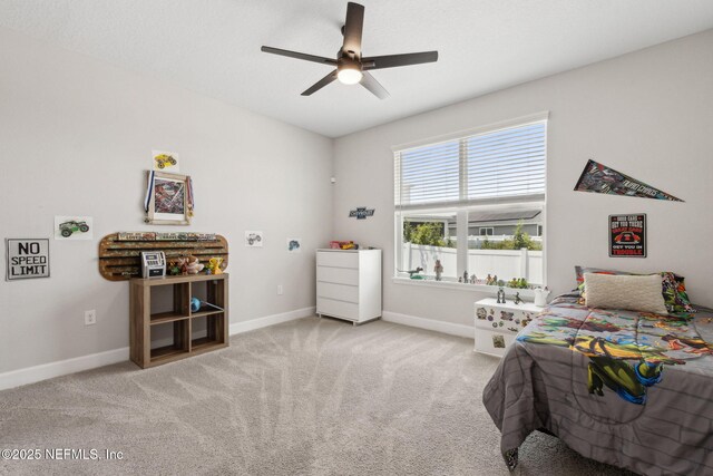 94001 Goodwood Dr, Fernandina Beach, FL 32034 - carpeted bedroom with baseboards and ceiling fan