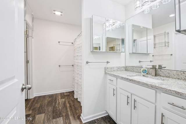 451 Sawmill Landing Dr, Saint Augustine, FL 32086 - bathroom featuring wood finished floors, vanity, baseboards, and a shower with shower curtain