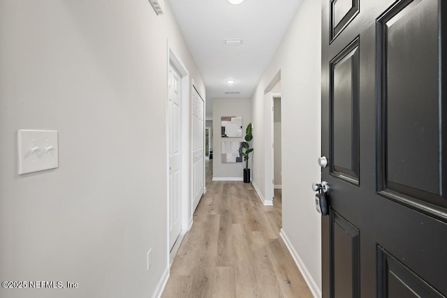 889 Aiken St, Saint Augustine, FL 32084 - hallway featuring light wood finished floors and baseboards