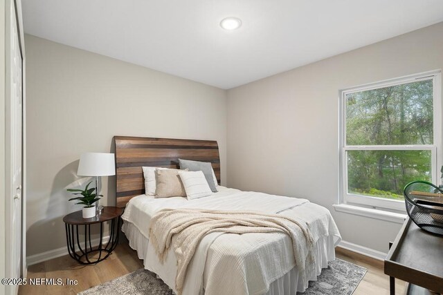 889 Aiken St, Saint Augustine, FL 32084 - bedroom with multiple windows, wood finished floors, baseboards, and recessed lighting