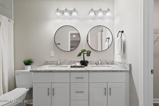 889 Aiken St, Saint Augustine, FL 32084 - bathroom with double vanity and toilet