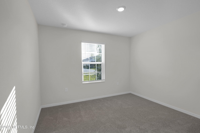 37330 Whisper Way, Hilliard, FL 32046 - carpeted spare room featuring baseboards and a smoke detector