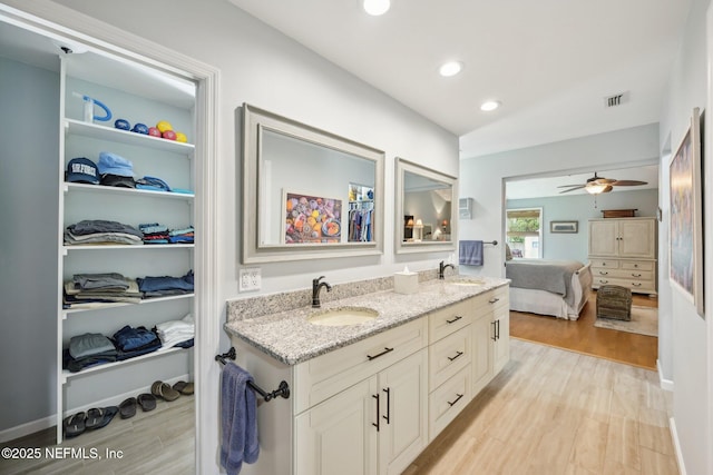 105 Solano Woods Dr, Ponte Vedra Beach, FL 32082 - full bathroom with wood finished floors, double vanity, recessed lighting, connected bathroom, and a spacious closet