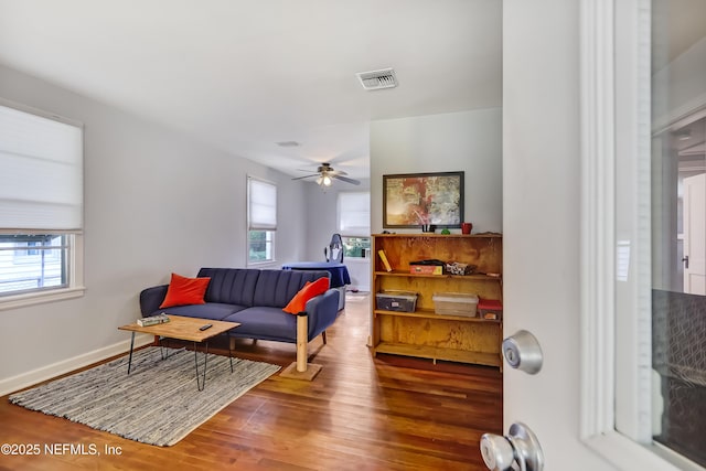 1131 Wycoff Ave, Jacksonville, FL 32205 - living area featuring healthy amount of natural light, wood finished floors, and a ceiling fan
