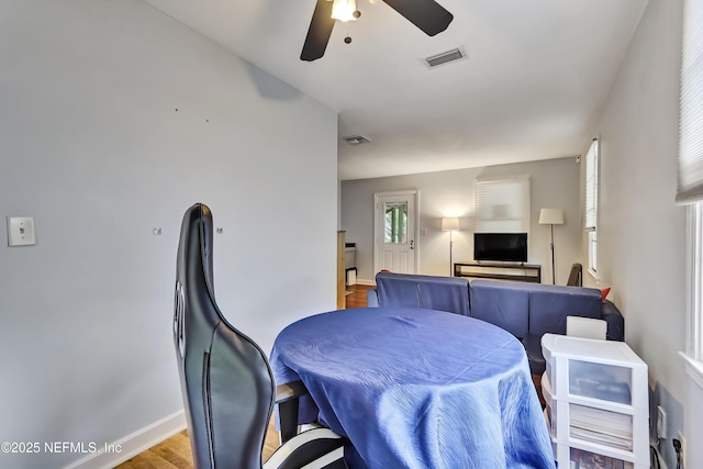 1131 Wycoff Ave, Jacksonville, FL 32205 - dining area with ceiling fan, baseboards, and wood finished floors