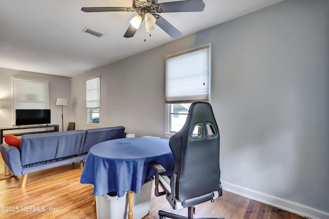 1131 Wycoff Ave, Jacksonville, FL 32205 - office featuring wood finished floors, ceiling fan, and baseboards