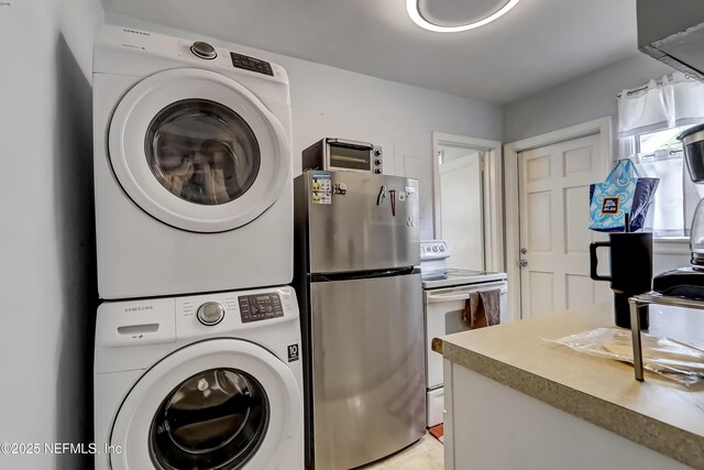 1131 Wycoff Ave, Jacksonville, FL 32205 - laundry room featuring stacked washer / drying machine