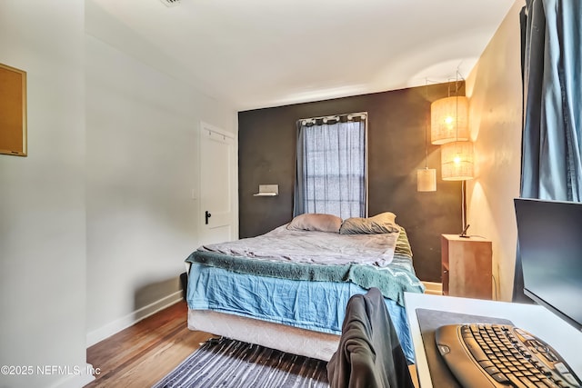 1131 Wycoff Ave, Jacksonville, FL 32205 - bedroom featuring wood finished floors and baseboards