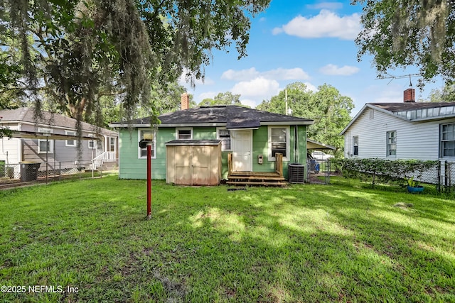 1131 Wycoff Ave, Jacksonville, FL 32205 - rear view of house featuring central air condition unit, a chimney, entry steps, and an outdoor structure