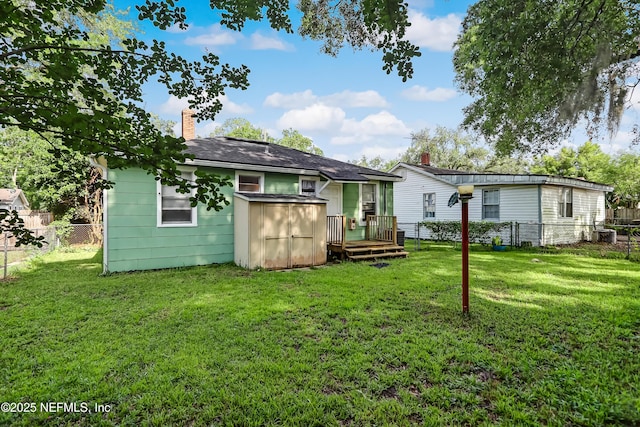 1131 Wycoff Ave, Jacksonville, FL 32205 - rear view of house with a chimney and a deck
