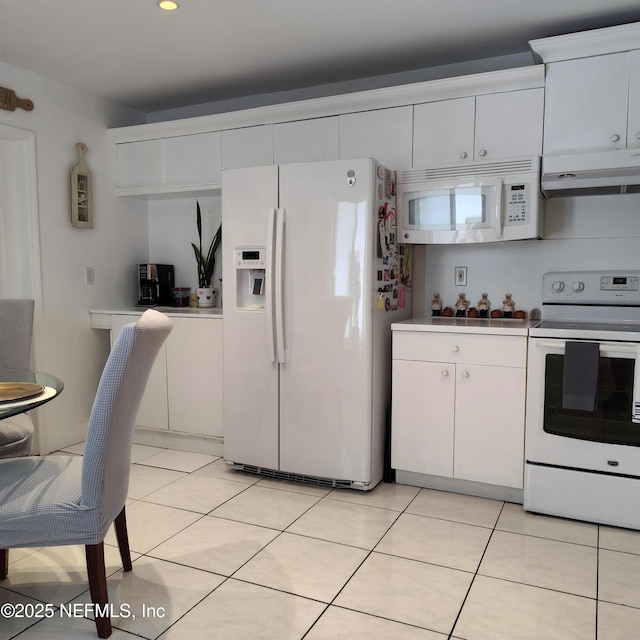 7486 SW 162nd Ct E, Miami, FL 33193 - kitchen featuring white appliances, range hood, white cabinetry, light tile patterned flooring, and light countertops