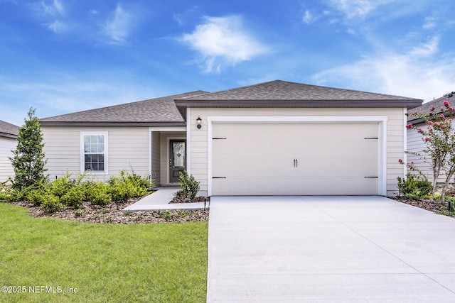 37132 Whippoorwill Ct, Hilliard, FL 32046 - ranch-style home with driveway, a garage, a front yard, and a shingled roof