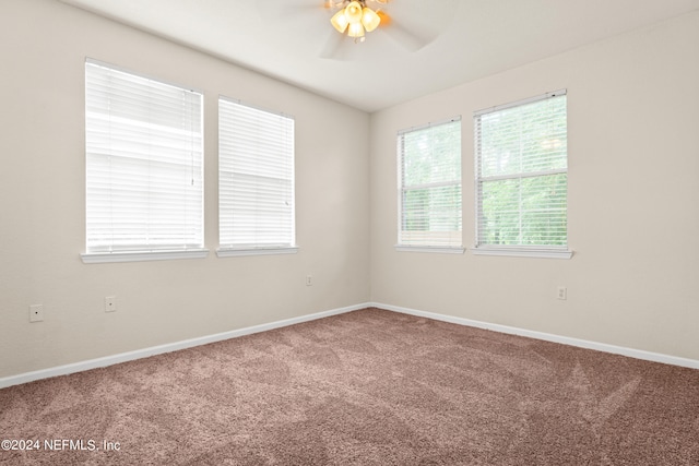 8550 Touchton Rd Unit 122, Jacksonville, FL 32216 - carpeted spare room featuring ceiling fan, healthy amount of natural light, and baseboards