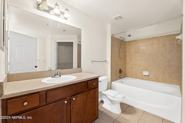 8550 Touchton Rd Unit 122, Jacksonville, FL 32216 - full bath with toilet, tub / shower combination, vanity, tile patterned flooring, and a spacious closet