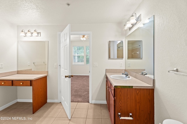 8550 Touchton Rd Unit 122, Jacksonville, FL 32216 - bathroom with vanity, tile patterned flooring, and baseboards