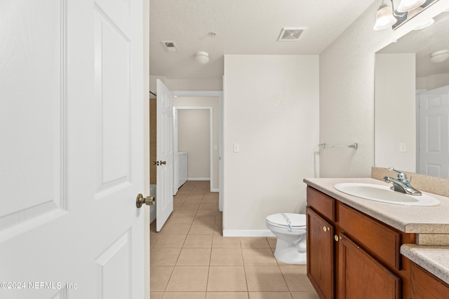 8550 Touchton Rd Unit 122, Jacksonville, FL 32216 - bathroom with tile patterned flooring, vanity, toilet, and baseboards