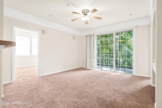 8550 Touchton Rd Unit 122, Jacksonville, FL 32216 - carpeted empty room with a ceiling fan, crown molding, healthy amount of natural light, baseboards, and a pendent fire sprinkler
