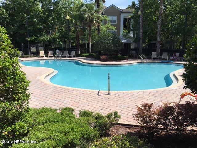8550 Touchton Rd Unit 122, Jacksonville, FL 32216 - community pool featuring a patio
