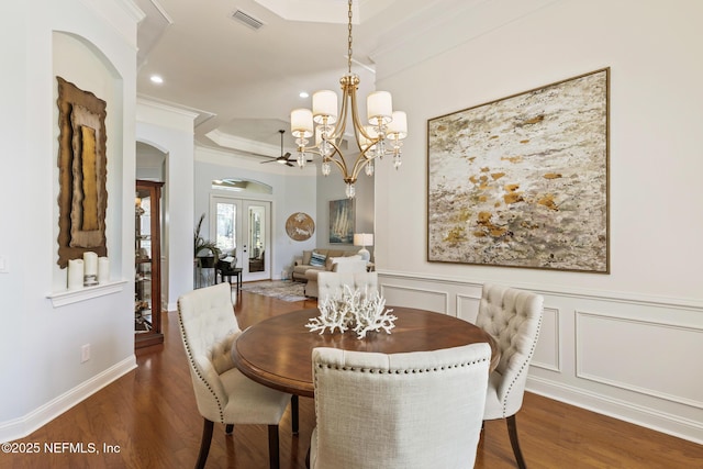 2435 Den St, Saint Augustine, FL 32092 - dining room with wood finished floors, a chandelier, crown molding, arched walkways, and recessed lighting