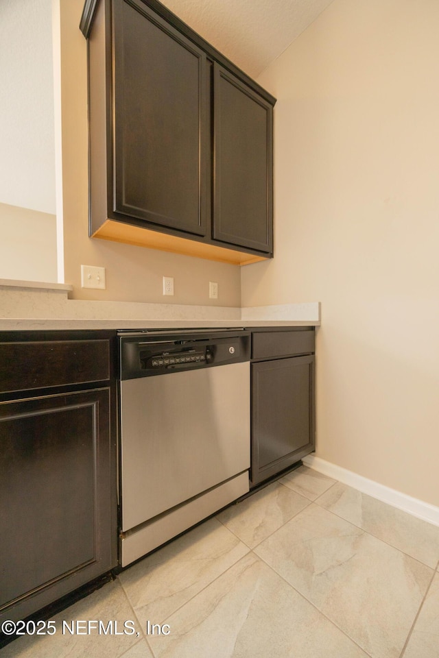 246 Moultrie Village Ln, Saint Augustine, FL 32086 - kitchen with dishwasher, baseboards, light countertops, and light tile patterned floors