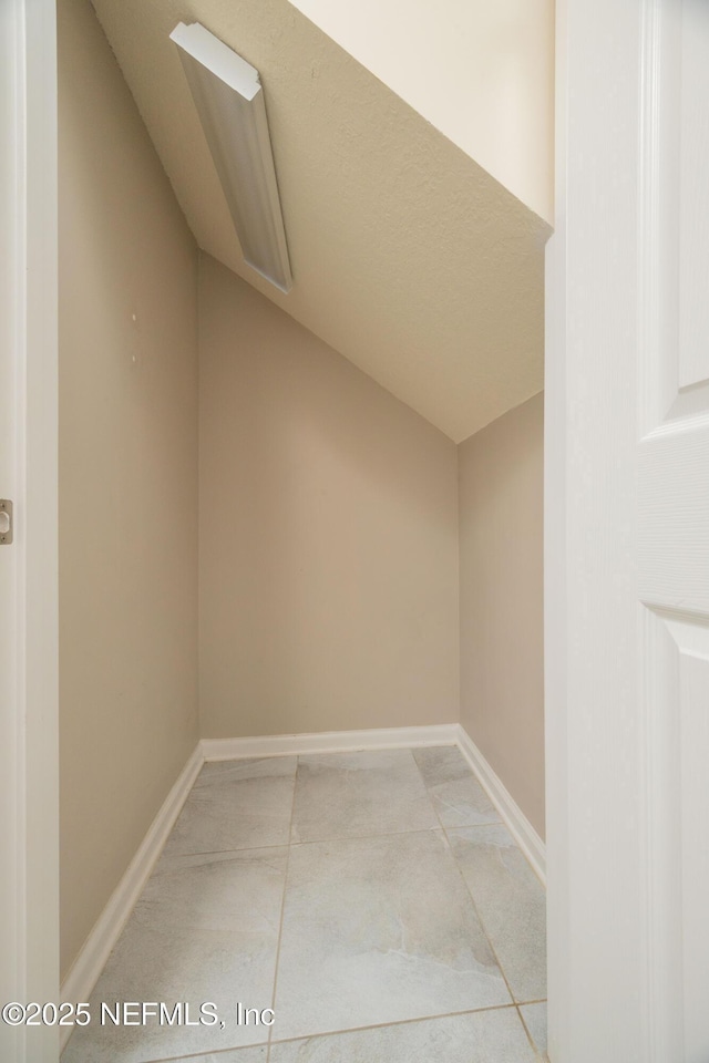 246 Moultrie Village Ln, Saint Augustine, FL 32086 - additional living space featuring vaulted ceiling and baseboards