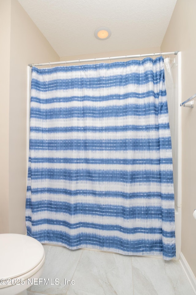 246 Moultrie Village Ln, Saint Augustine, FL 32086 - bathroom featuring toilet, a shower with curtain, and tile patterned flooring