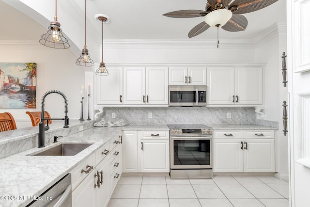 2315 Vista Cove Rd, Saint Augustine, FL 32084 - kitchen with stainless steel appliances, a sink, a ceiling fan, tasteful backsplash, and light tile patterned floors