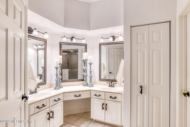 2315 Vista Cove Rd, Saint Augustine, FL 32084 - bathroom with a closet, double vanity, and a shower with shower door