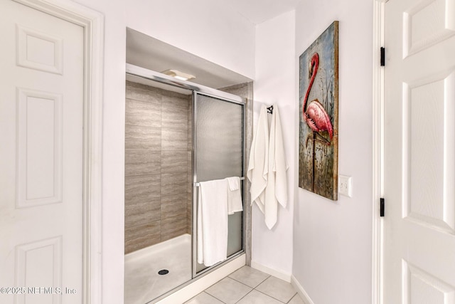 2315 Vista Cove Rd, Saint Augustine, FL 32084 - bathroom with a stall shower, tile patterned floors, and baseboards