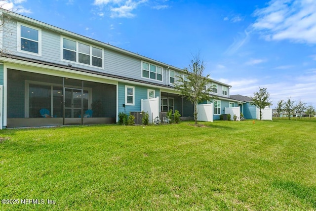 217 Silver Myrtle Ct, Saint Augustine, FL 32092 - back of house with a sunroom, a yard, and central AC