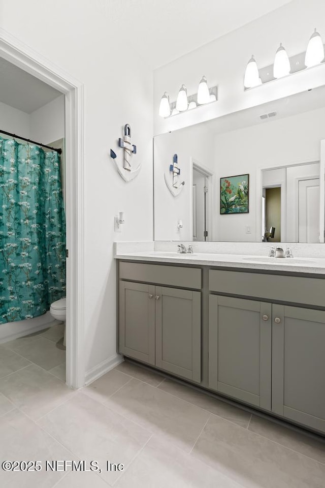 217 Silver Myrtle Ct, Saint Augustine, FL 32092 - bathroom featuring double vanity, tile patterned floors, curtained shower, toilet, and baseboards